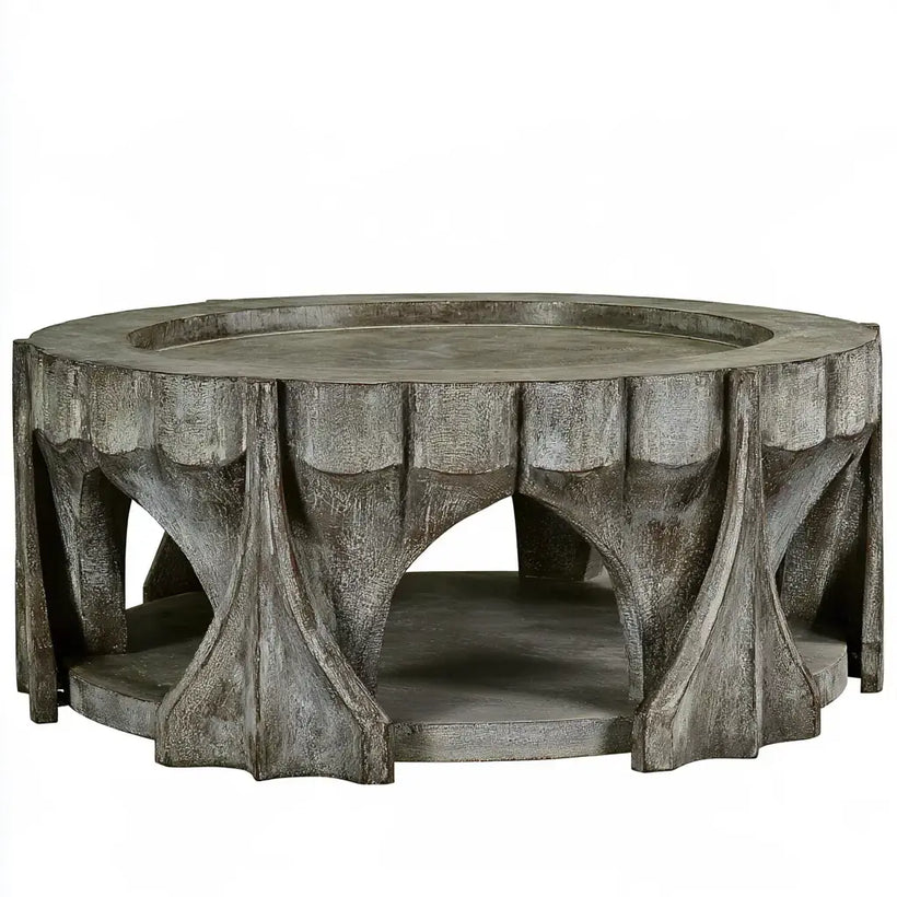 Mesa de centro redonda gris con base de formas ramificadas de la marca Vardica, diseño moderno y elegante.